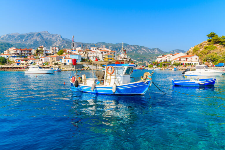 Typical blue and white colour fishing boat in Kokkari port, Samos